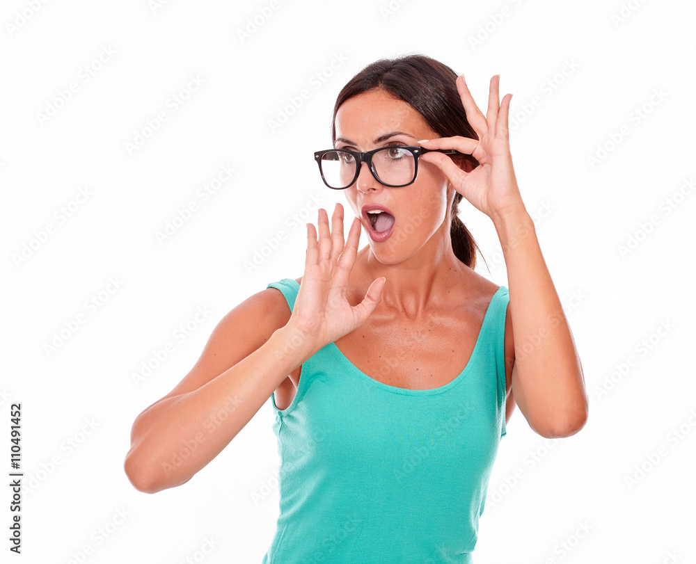 Shocked adult woman with a hand to her mouth Shocked adult woman with a hand to her mouth