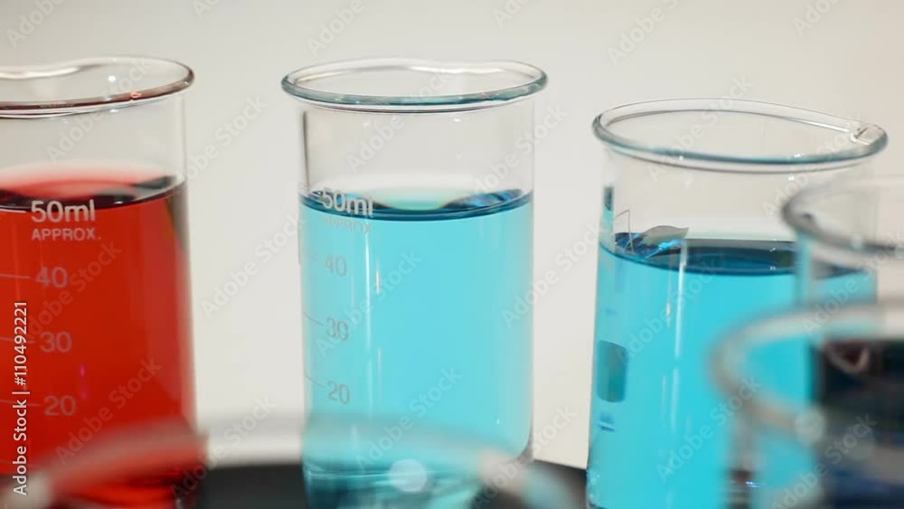 Rotating beakers with red and blue liquid Rotating beakers with red and blue liquid