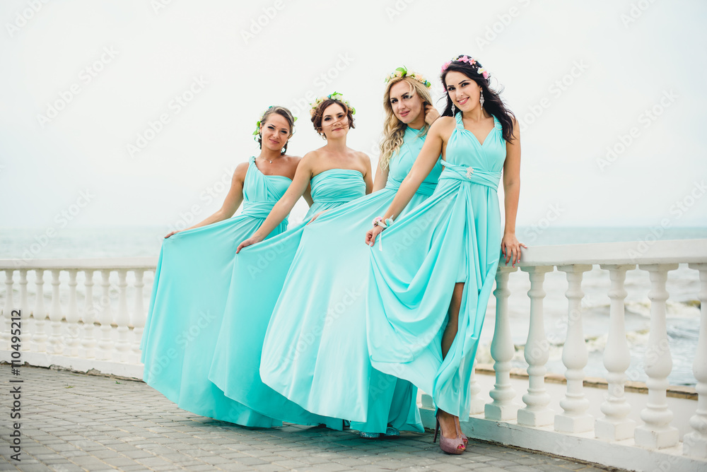 Bridesmaids on the seaside in blue dresses