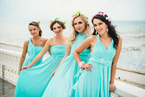 Bridesmaids on the seaside in blue dresses