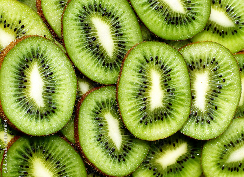 fresh kiwifruit background. round slices closeup fresh kiwifruit background. round slices closeup