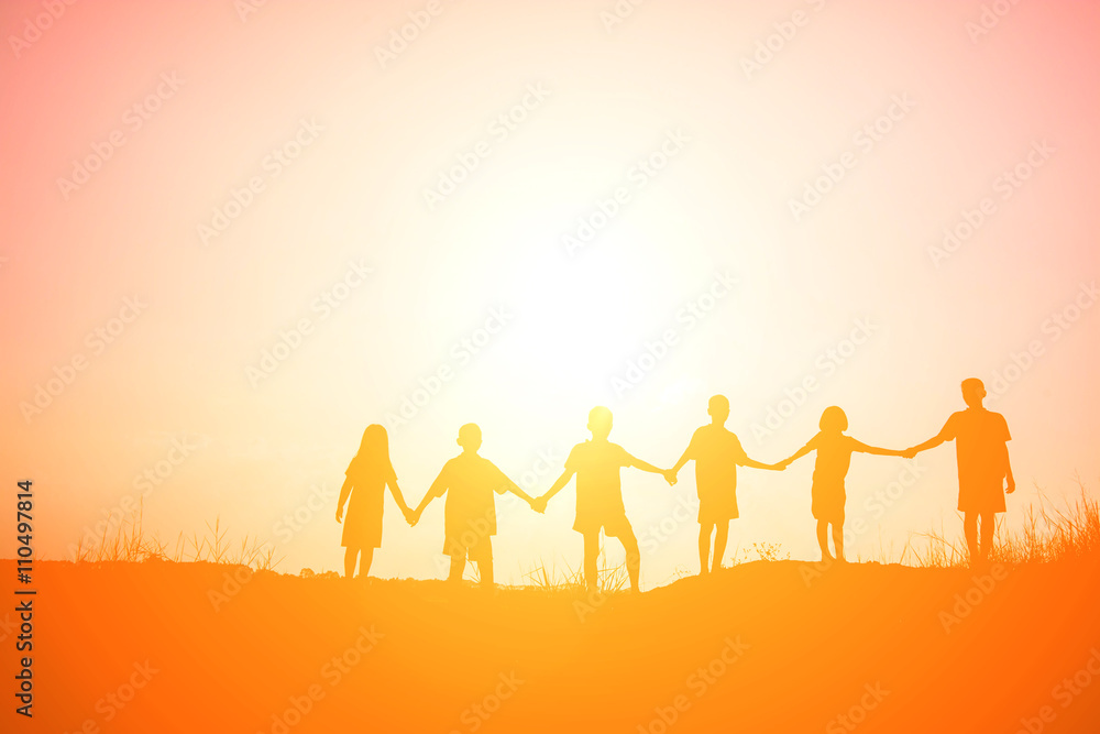 Children playing on summer sunset happy time Children playing on summer sunset happy time