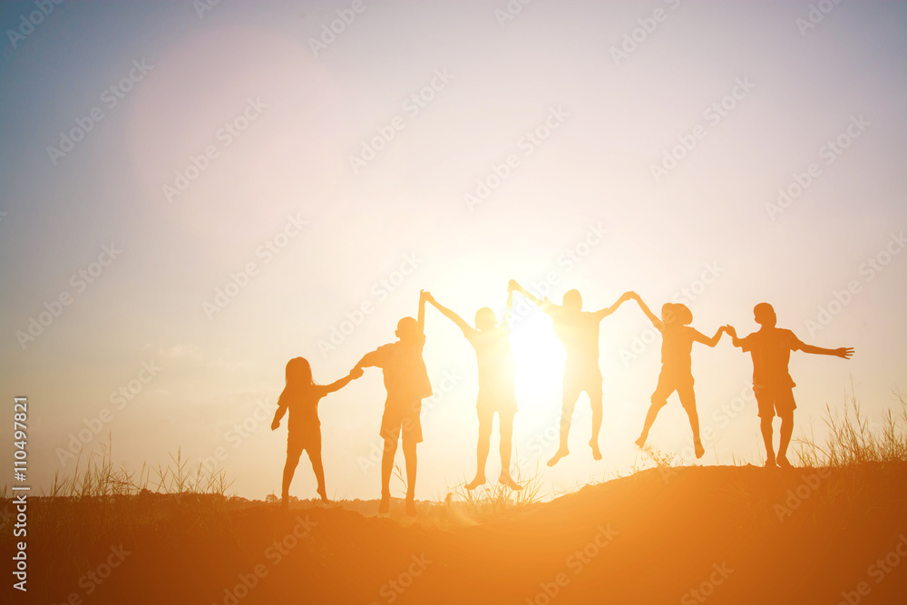Fototapeta premium Silhouette of children jump gladness happy time
