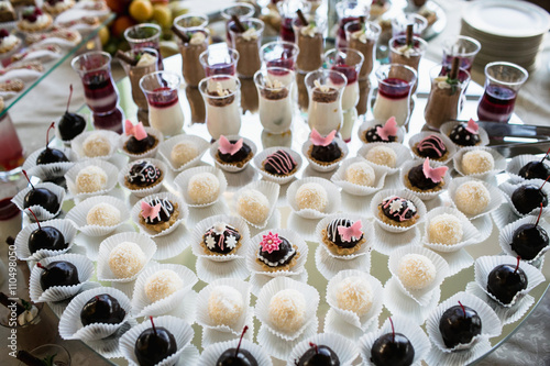 Luxury cakes on wedding dessert table in restaurant