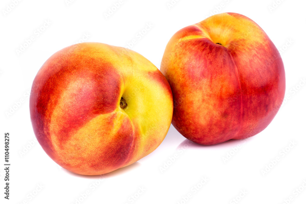 Ripe nectarines on white background. Closeup. Ripe nectarines on white background. Closeup.