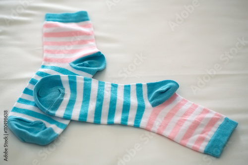 Striped socks on beige backdrop