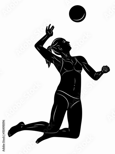 Silhouette of woman playing volleyball