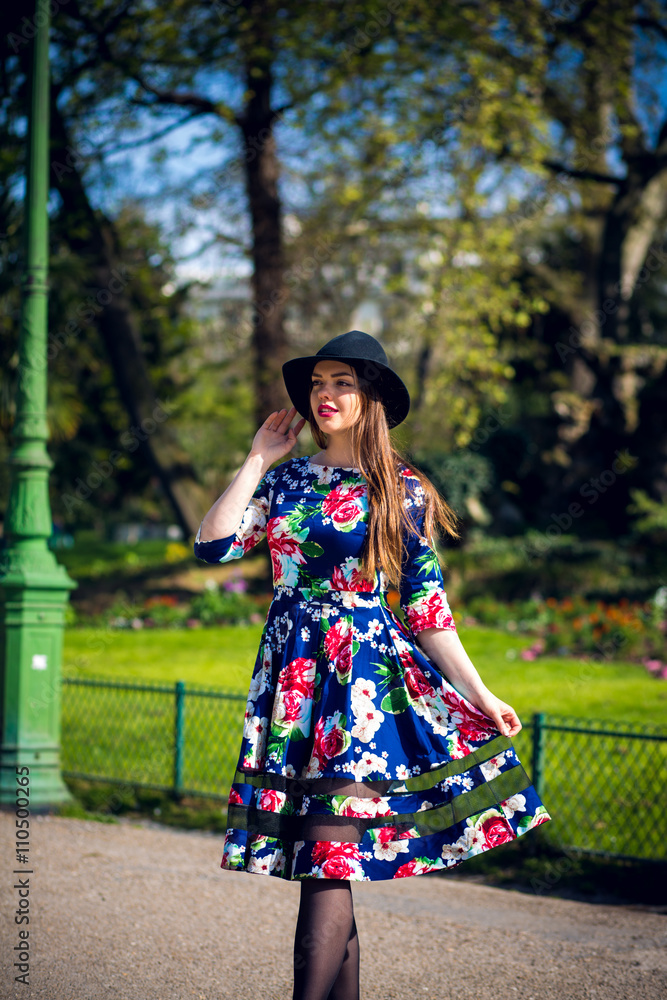 beautiful young girl posing against a background of park beautiful young girl posing against a background of park