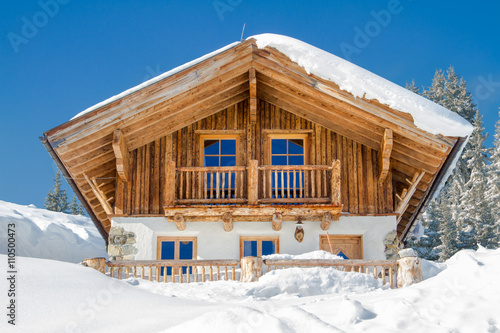 Mountain chalet in the alps in winter photo