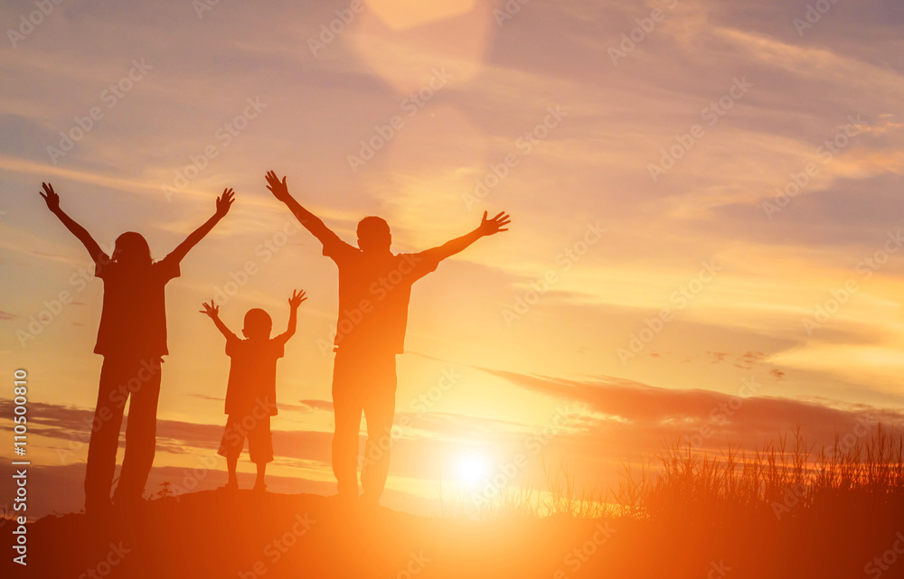 silhouette of a happy family and happy time sunset