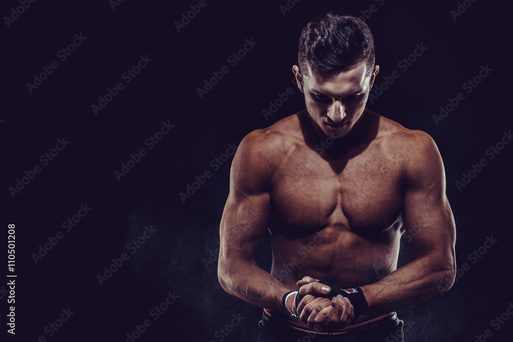 Fototapeta premium MMA Fighter Preparing Bandages For Training