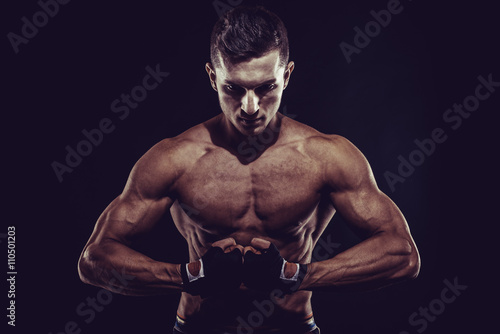 MMA Fighter Preparing Bandages For Training © Elena Kharichkina