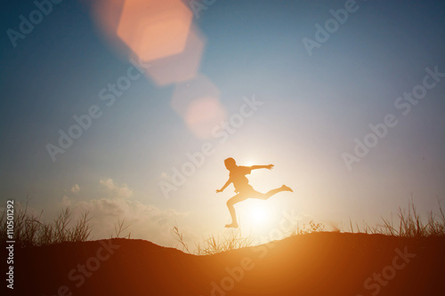  little boy jumping and having happy time, Sillhouette concept