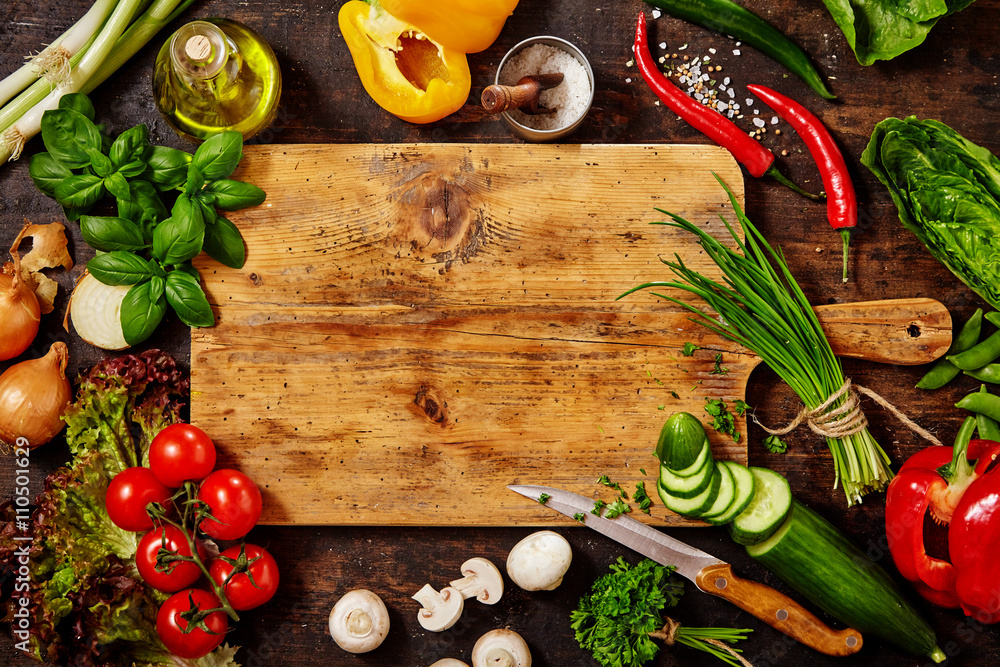 Cutting Board and Knife with Vegetables on Table - obrazy, fototapety, plakaty 