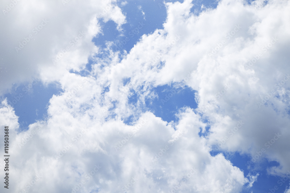 Bright blue sky with clouds closeup
Bright blue sky with clouds closeup