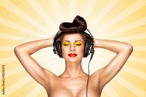 Vintage Nudist Girls - Nude pin-up party / Retro photo of a nude pin-up girl with big vintage  music headphones on colorful abstract cartoon style background. Stock Photo  | Adobe Stock
