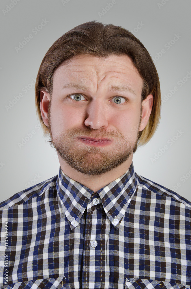 Obraz premium Young man grimace.