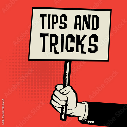 Poster in hand, business concept with text Tips and Tricks