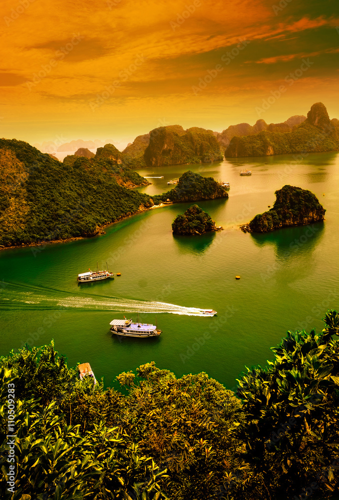 Fototapeta premium HALONG bay in sunset in vietnam. UNESCO World Heritage Site. This view from TiTop island and its most popular view for travel in Halong bay. 