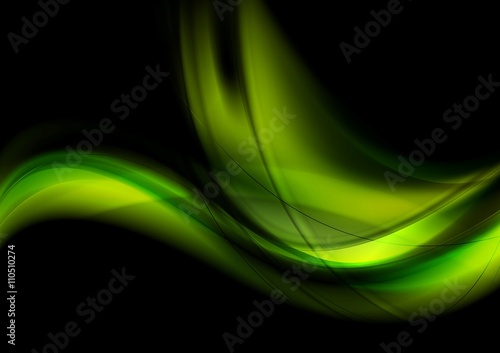 Bright green glowing waves on black background