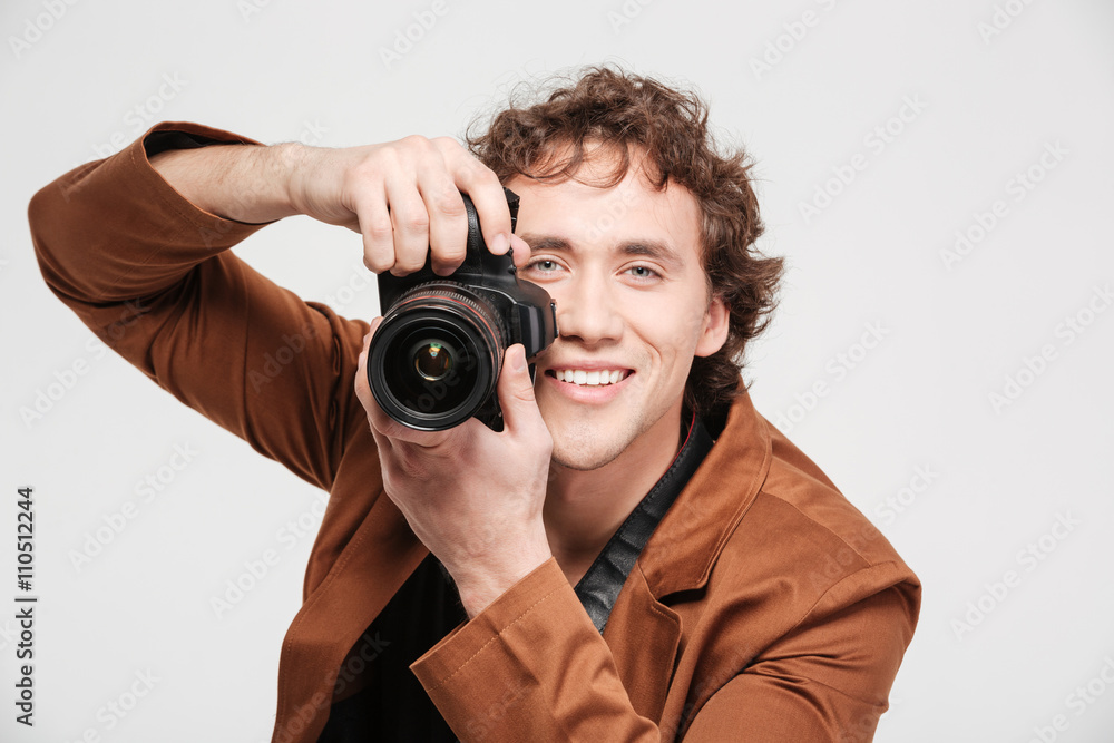 Smiling man photographing Smiling man photographing