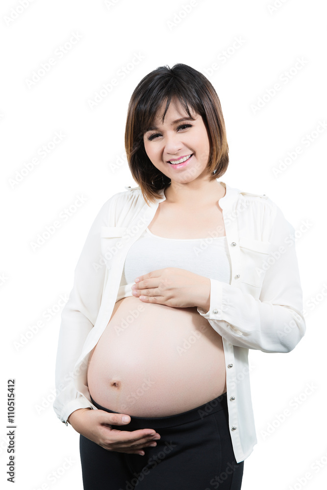 Portrait of the beautiful 9 month pregnant woman happy posing Portrait of the beautiful 9 month pregnant woman happy posing
