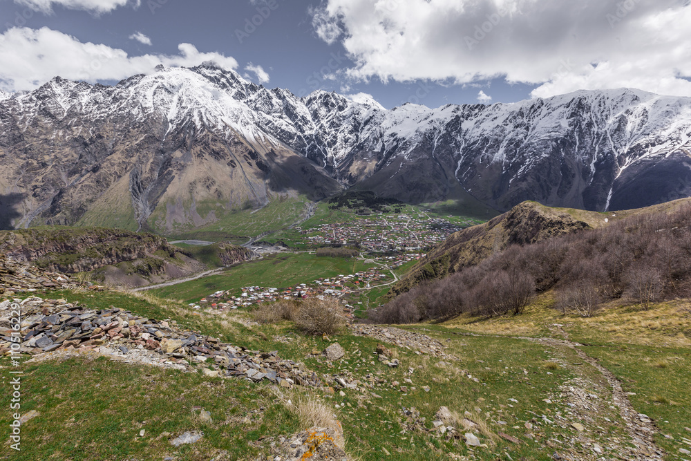 Aerial view of Stepantsminda Kazbegi small town near mountain Ka