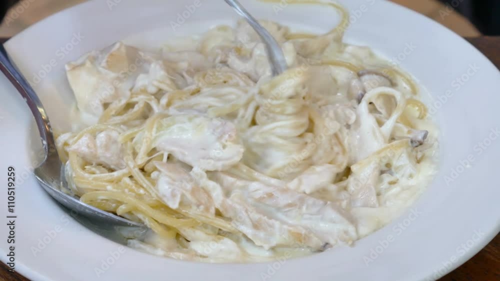 People eating spaghetti carbonara People eating spaghetti carbonara