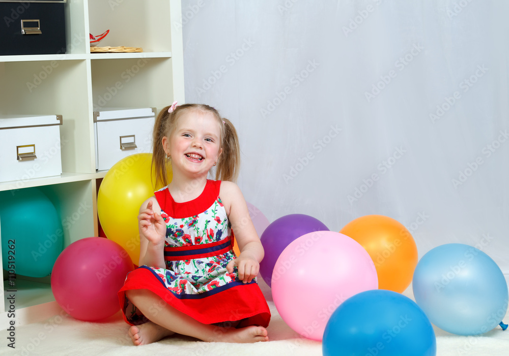 portrait of a little girl playing with balls portrait of a little girl playing with balls