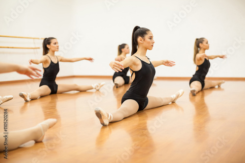 Female dancers doing warm up exercises