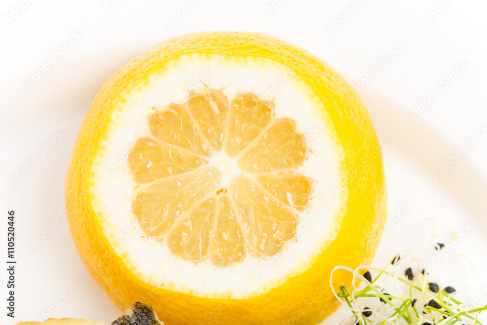 Closeup of sliced lemon for baked seabass. Closeup of sliced lemon for baked seabass.