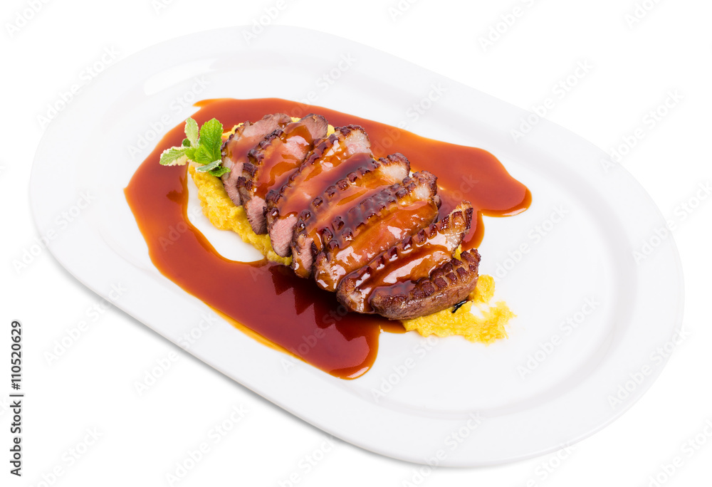 Grilled duck breast on mango puree. Grilled duck breast on mango puree.