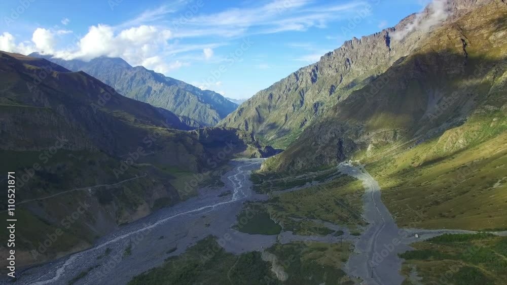 Aerial view of mountain and Terek river near Stepantsminda, Georgia. Camera flies on drone. Aerial view of mountain and Terek river near Stepantsminda, Georgia. Camera flies on drone.