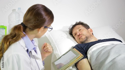 Sad man getting bad news about health in hospital from doctor medium shot