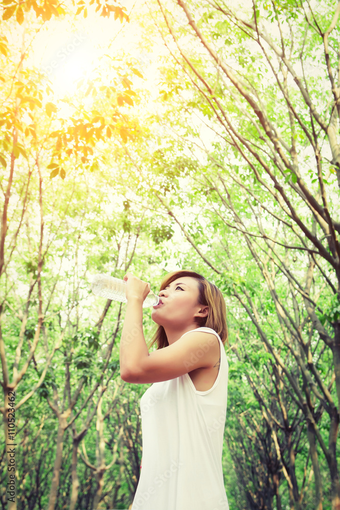 Portrait of young beautiful woman wearing white dress drinking Portrait of young beautiful woman wearing white dress drinking
