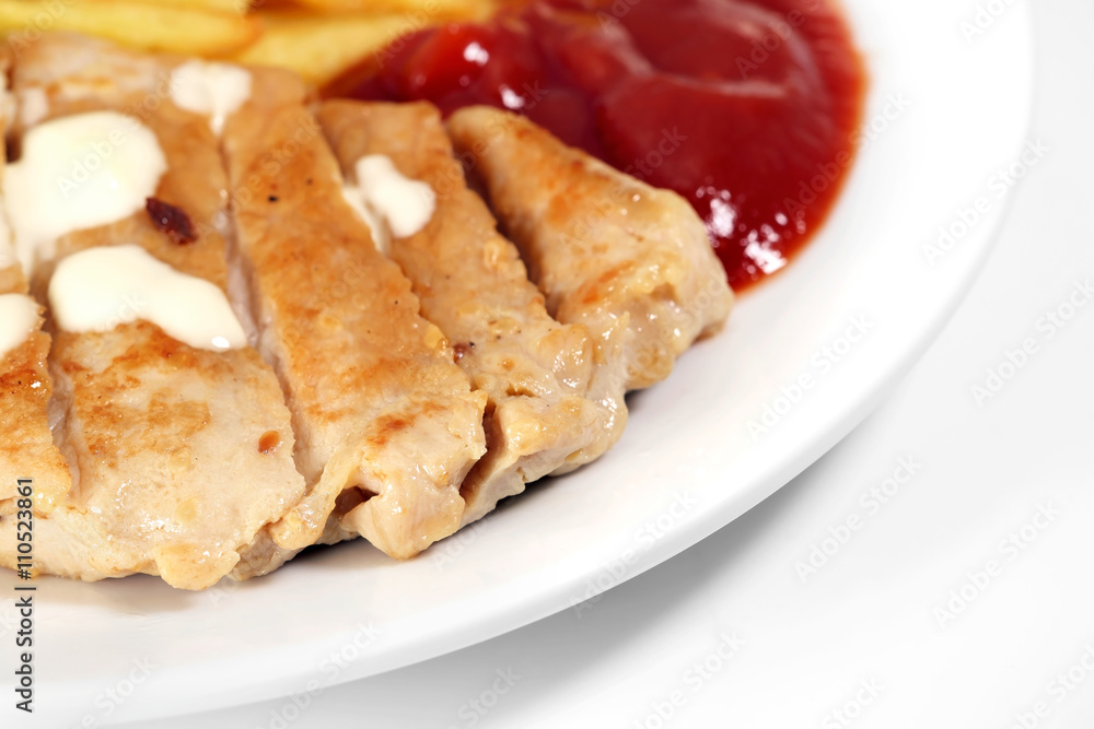 Fried pork / Fried pork and fried potatoes with ketchup on white plate.