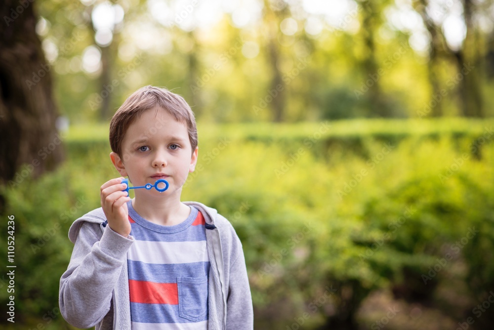 Little boy blowing soap bubbles Little boy blowing soap bubbles