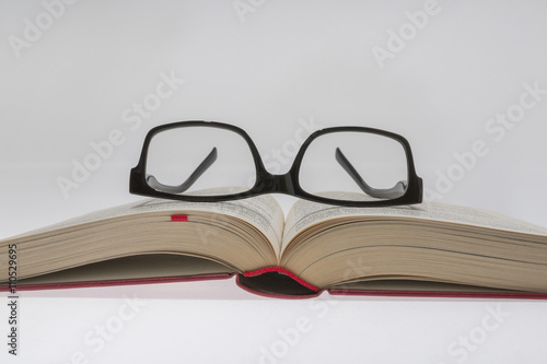book with reading glasses