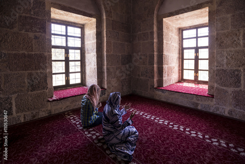 Muslim Women Praying In Mosque © sezer66
