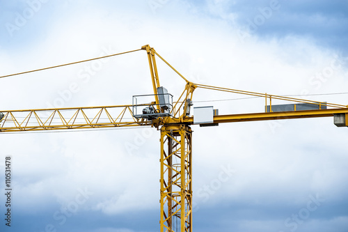 Construction crane with cloudy sky