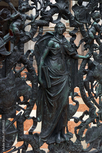Detail of the bronze railing of the entrance of Venice bell tower