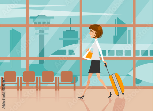 Young businesswoman with suitcase at the airport