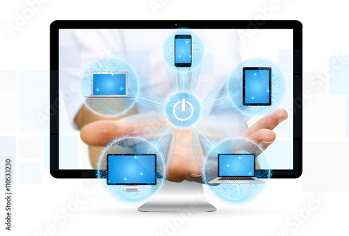 Colorful tech devices and icons applications in businessman hand