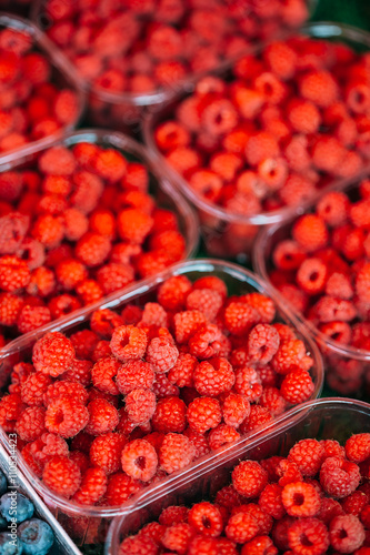 Yummy Red Berries Raspberries At Market In Trays