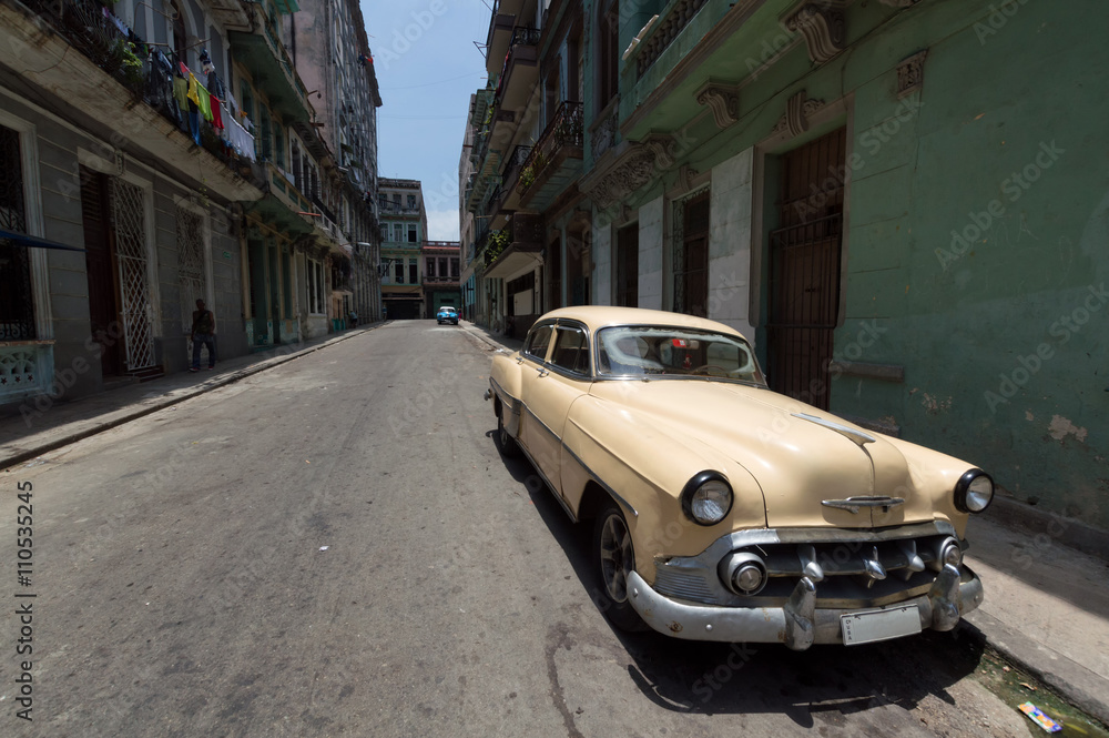 Old american car parked in Old Havana street