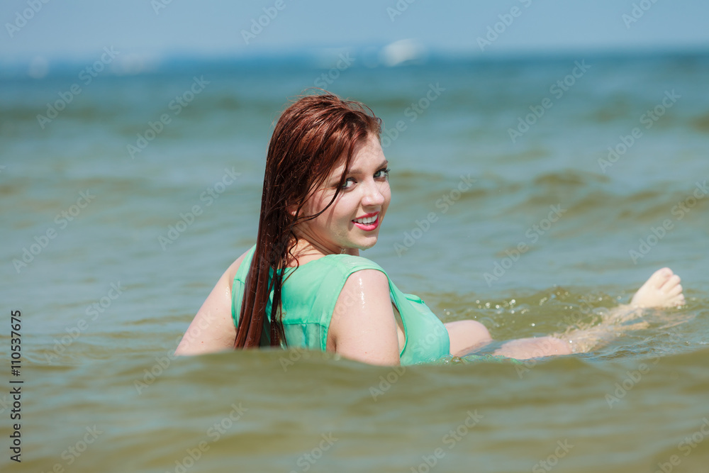 Sensual girl wet cloth in water on the coast. Sensual girl wet cloth in water on the coast.