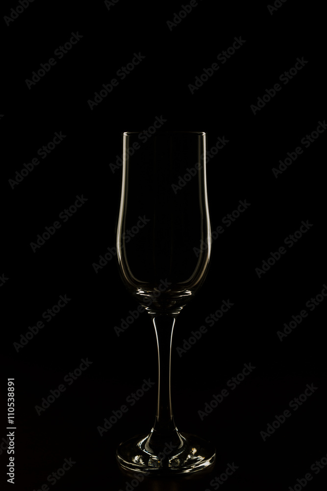 glass with red wine on a black background glass with red wine on a black background