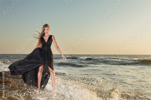 Fashion model posing at sea