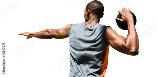 Φωτογραφία Rear view of sportsman practising discus throw