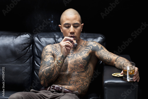 african american gangsta smoking and drinking. photo